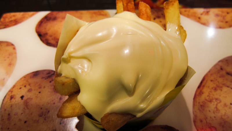 French fries topped with....mayonnaise?
