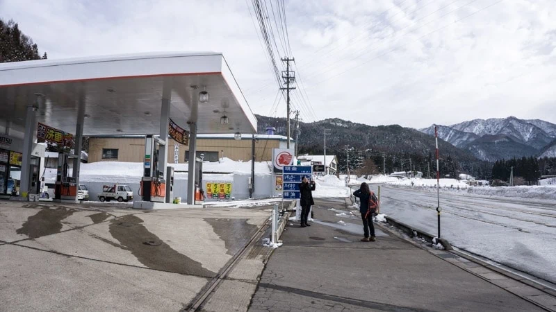 The Kanbayashi Onsen Guchi bus stop located next to this gas station