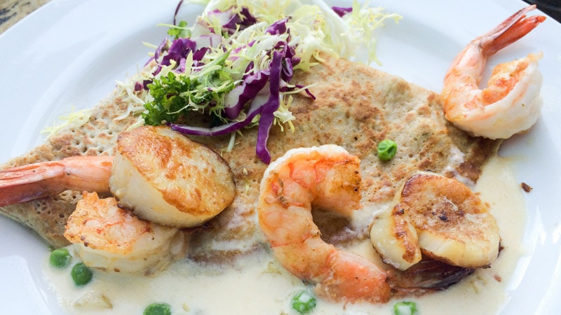 The Seafood Crêpe topped with scallops and shrimp