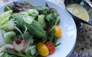 The Petite Salad Maison with a side of lemon-dijon vinaigreette