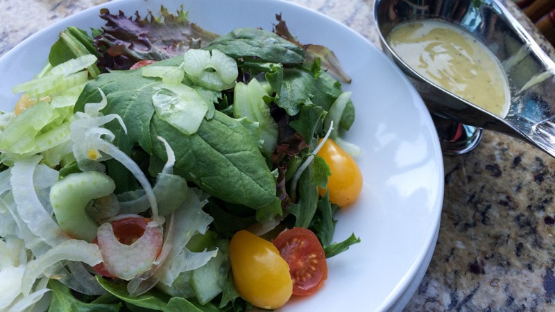 The Petite Salad Maison with a side of lemon-dijon vinaigreette