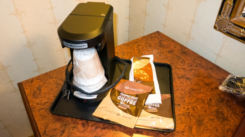 Basic coffee maker with a couple packets of coffee
