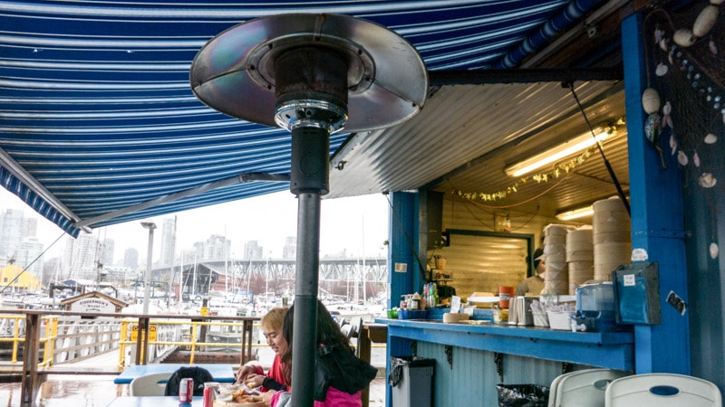 Covered outdoor seating and propane heaters are great on those cold and rainy days at Go Fish