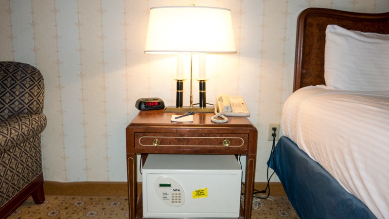 Nightstand near the bed with safe underneath