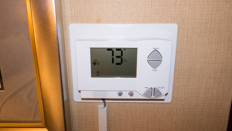 The air conditioner can be controlled by this wall unit (65-82 degrees)