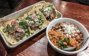 Short rib tacos with a side of rice and beans, Amor Y Tacos