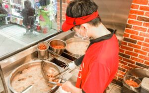 Chefs frying chicken in hot oil, Ji Guang Delicious Fried Chicken, Taipei, Taiwan