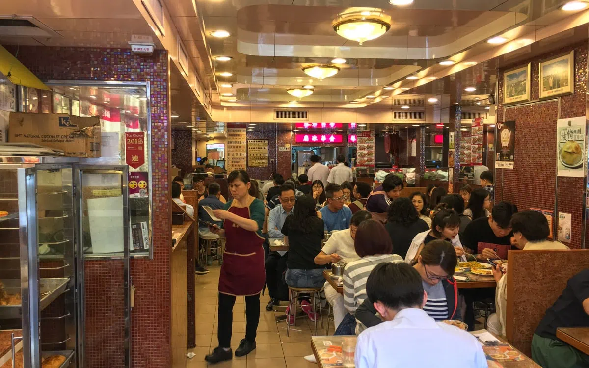 Busy interior of the restaurant, Kam Wah Cafe, Hong Kong 