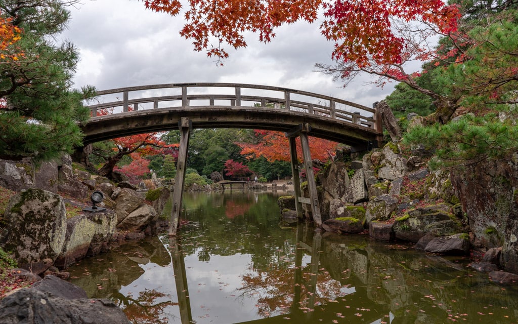 Arched bridge over pond, Genkyuen Garden
