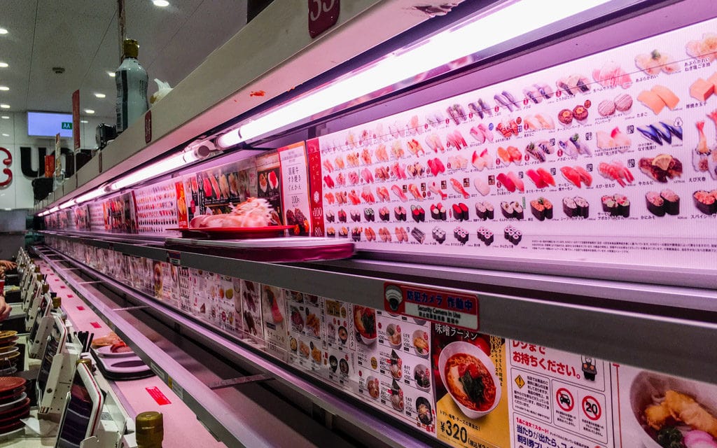 Sushi train arriving, Uobei Shibuya Dogenzaka, Tokyo, Japan