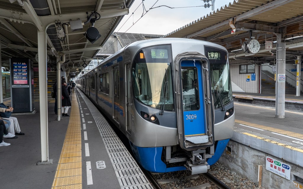 A Nishitetsu Express train bound for Dazaifu Station stopped at Nishitetsu Futsukaichi Station, Dazaifu, Fukuoka, Japan