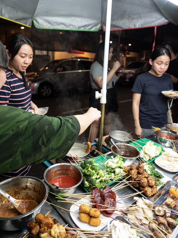 Dipping a skewer into the boiling water