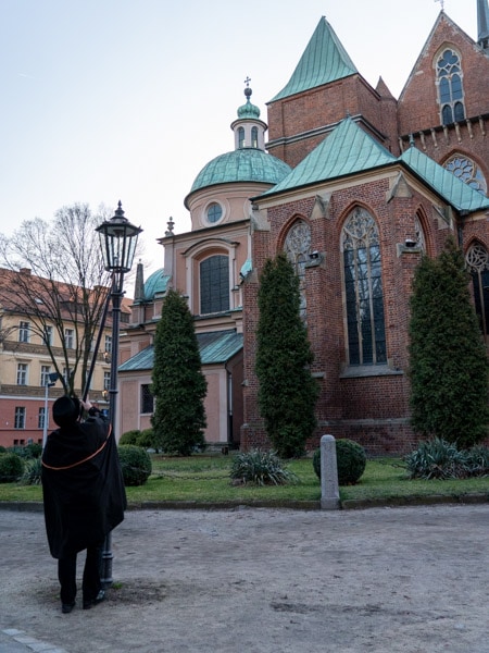 Lighting a lamp behind Wrocław Cathedral