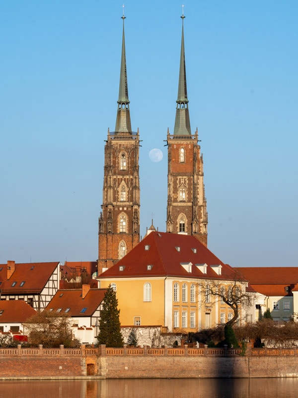 The moon passing through the towers