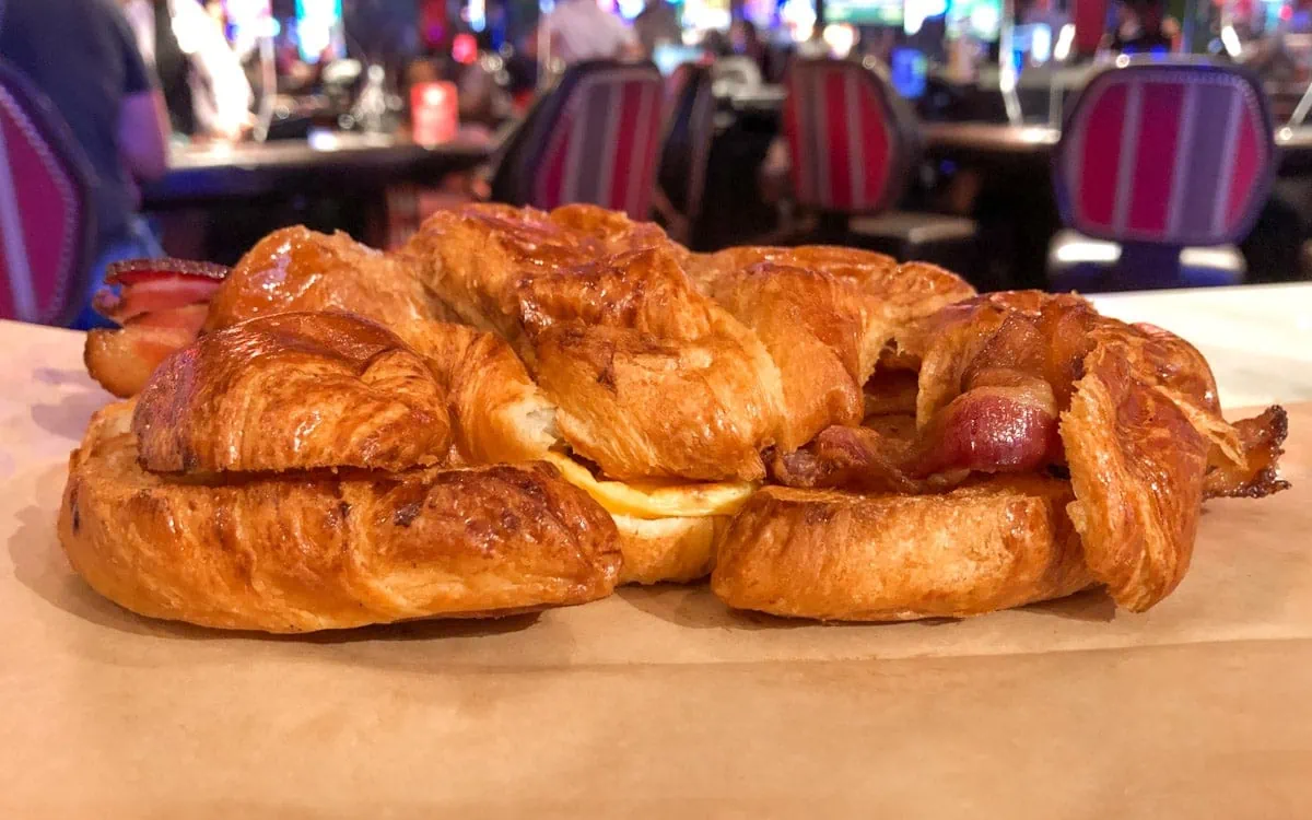 The Cromwell with bacon, egg, and cheese on a butter croissant