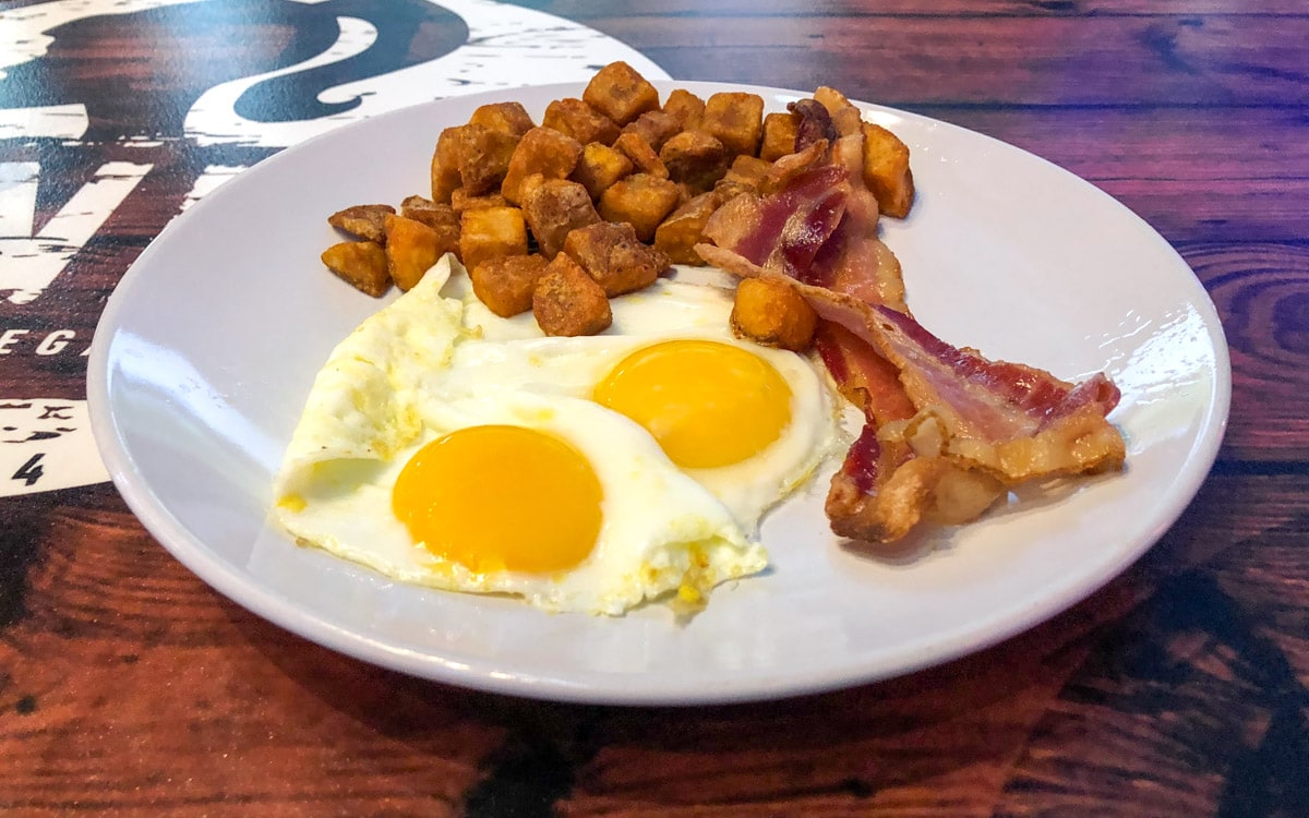 The $3.99 breakfast plate with two eggs, bacon, and potatoes