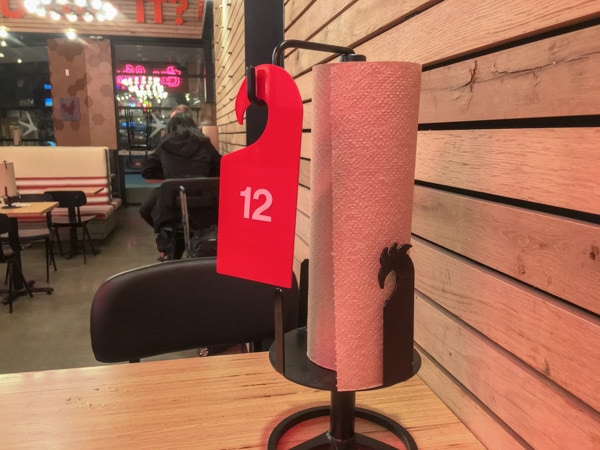 Hang your number on the hook at your table