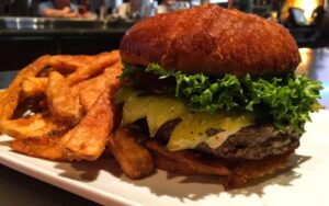 The Southwest Burger with a side of french fries[