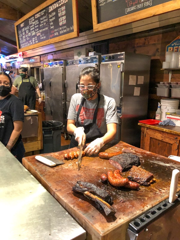 Smoked sausage being cut