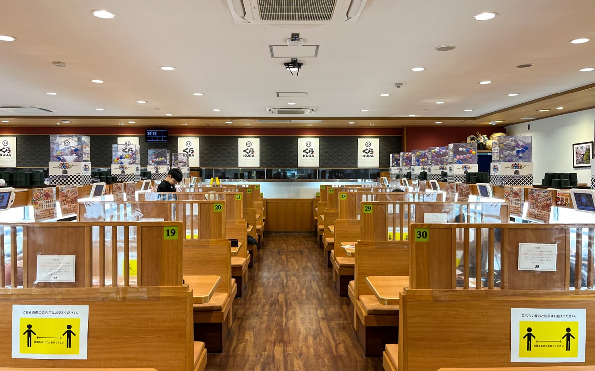 Open but compartmentalized interior of Kura Sushi, Osaka, Japan